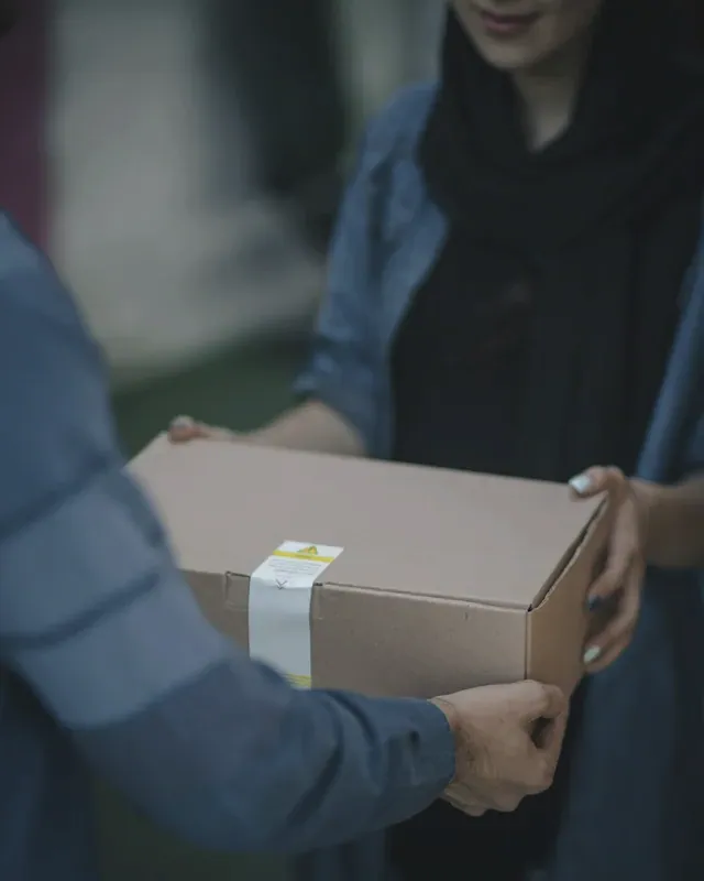 A package being handed over at a doorway