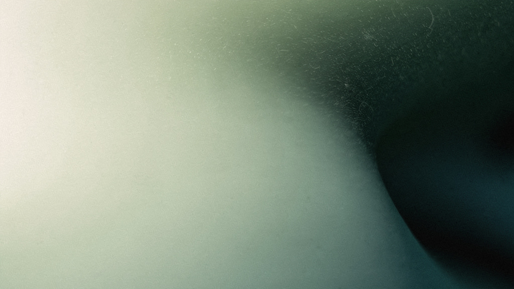 An abstract field where a warm, settled evening tone slides into a deep, unsettled teal, the calm of sedation giving way to a disrupted night.