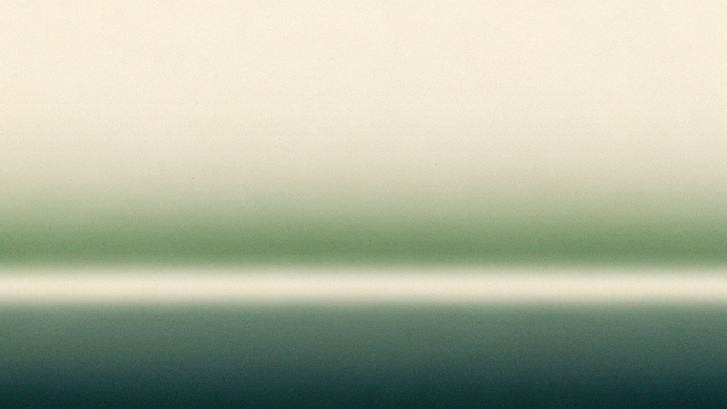 An abstract pale bone field crossed by a single soft, blurred boundary slid low in the frame, the same gentle matcha-into-teal gradient resting on either side, only the line repositioned.