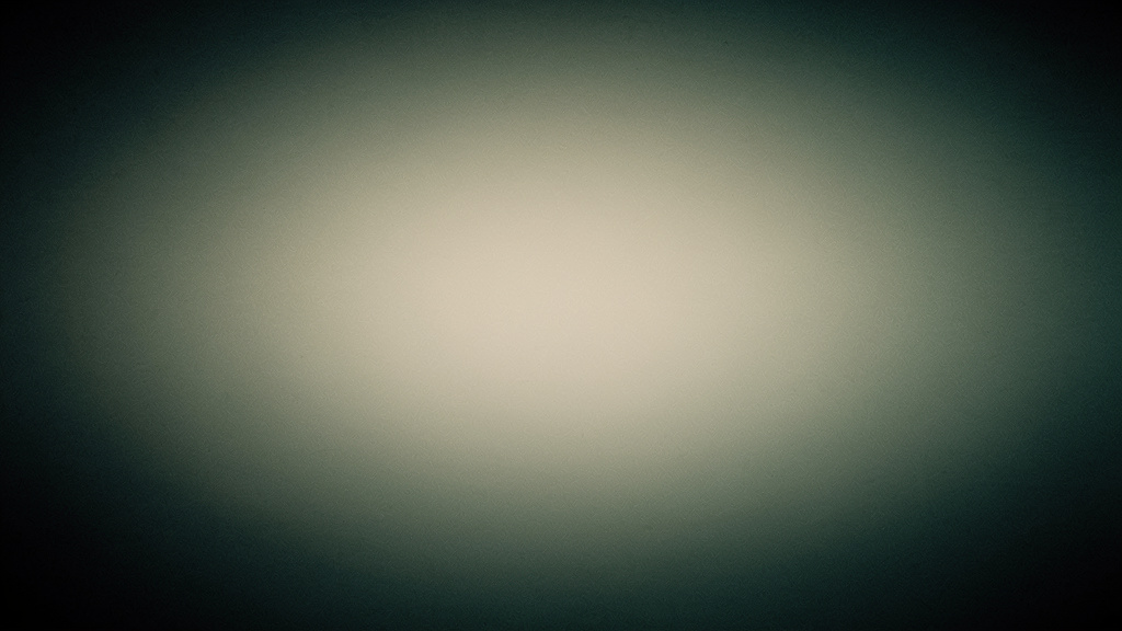 A soft glow on a bone field fades toward deep teal and ink at the edges, an abstract image of evening light dimming as night arrives.