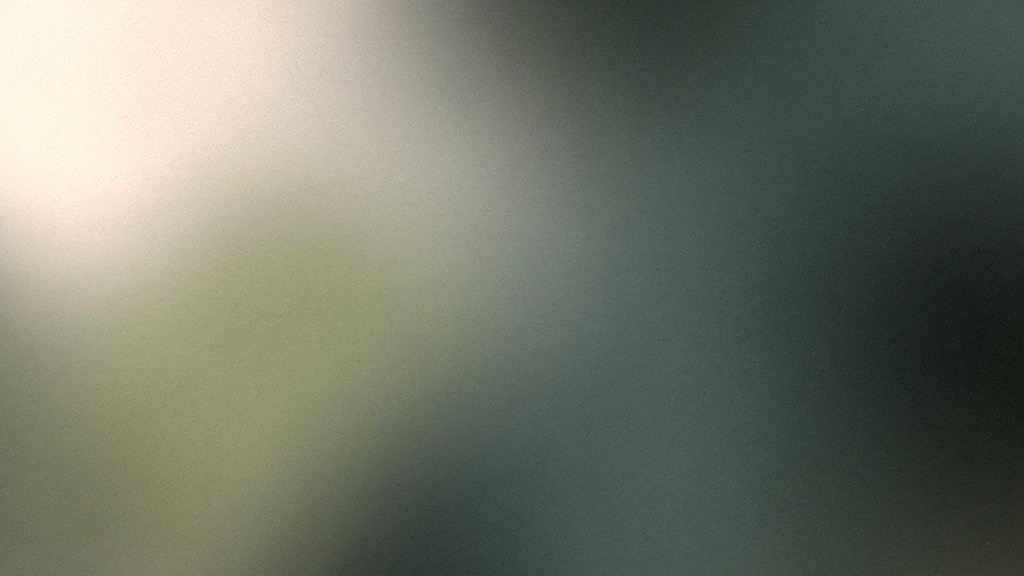 A calm bone field warming into soft matcha green on one side and settling into deep teal on the other, an abstract image of a day's borrowed alertness easing toward evening.