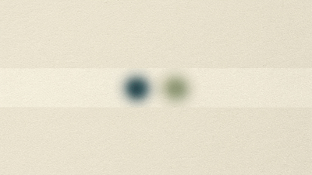 Two soft glowing points resting inside a single pale band on a bone-colored field, one cool deep teal and one warm matcha, alike at a glance and quietly not the same.