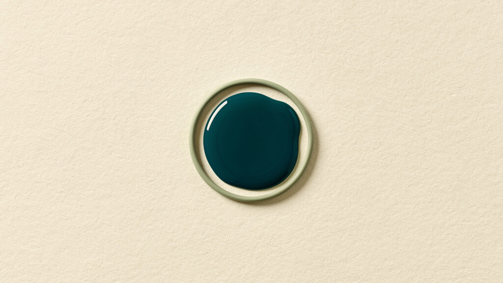 A small, concentrated pool of deep teal held inside a tight matcha sage ring on a bone field, an abstract image of a strong dose that works only in a narrow, defined place.
