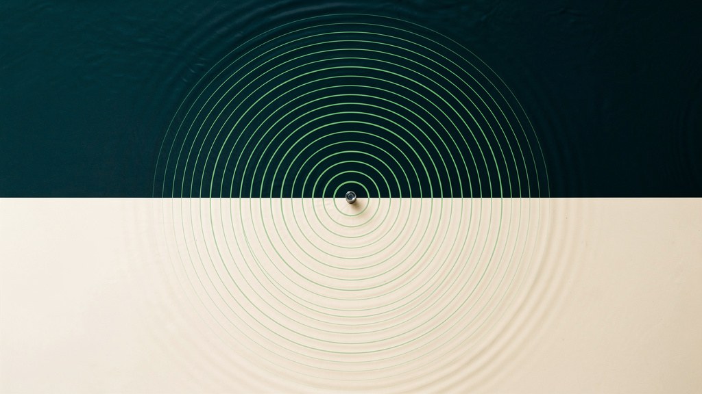 A still, cold deep-teal surface over a bone field with a single point of contact rippling outward in fine matcha rings, an abstract image of the calm before the shock of cold water.
