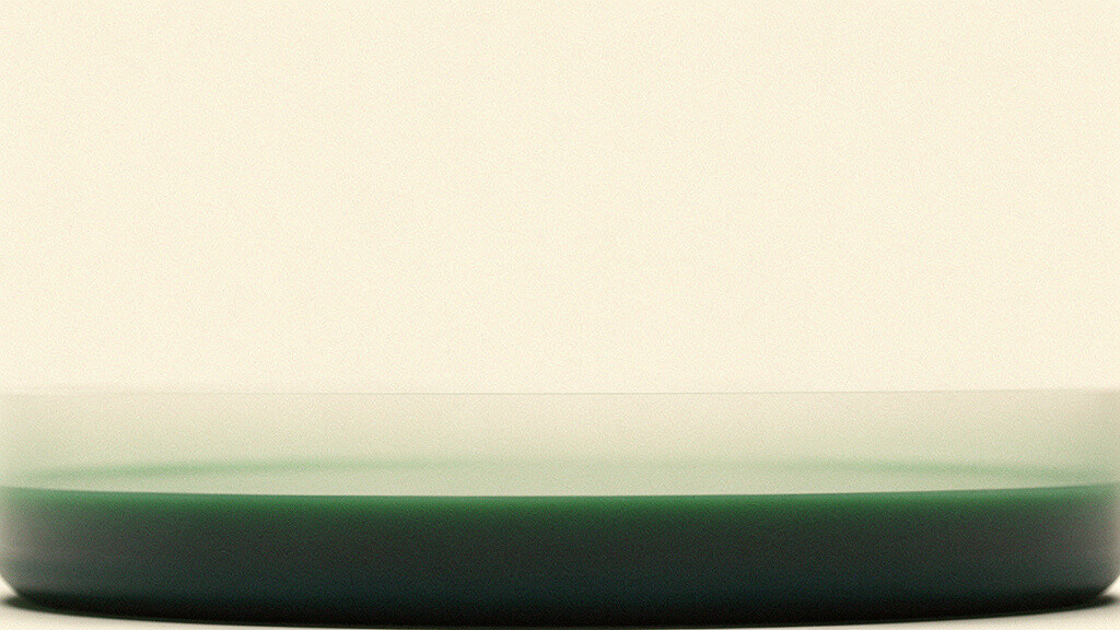 A calm bone-colored field holding a single low, layered horizontal band of soft matcha settling into deep teal, an abstract image of a stored reserve held level and steady in an unseen vessel.